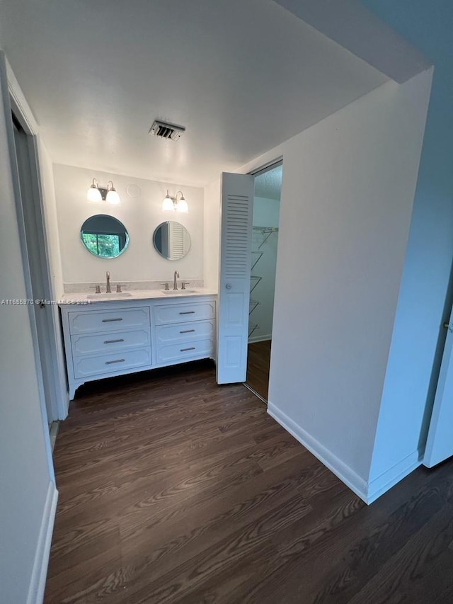 bathroom featuring vanity and hardwood / wood-style flooring