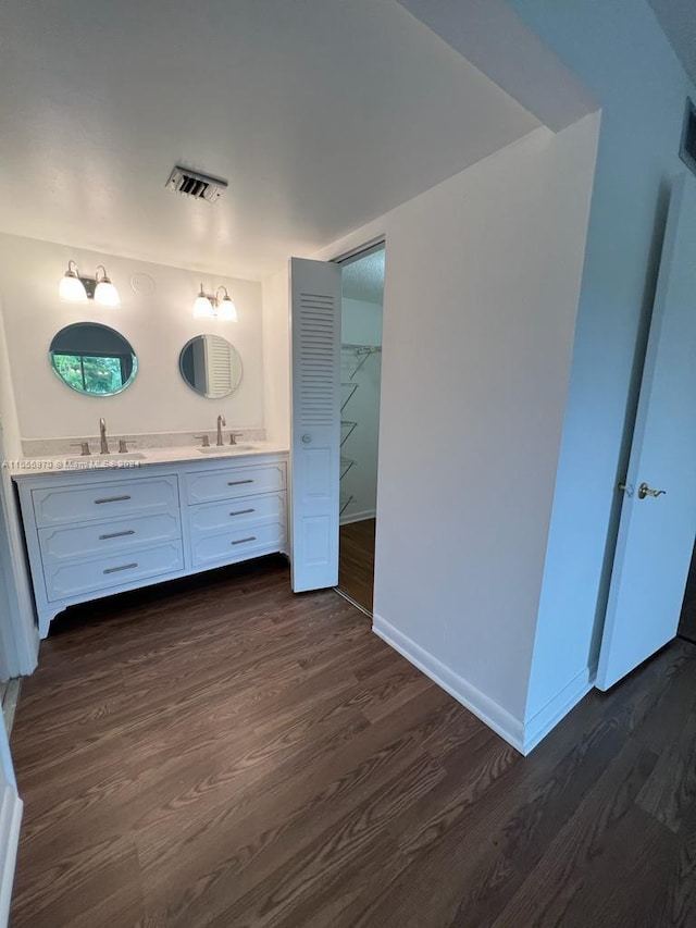 bathroom with vanity and hardwood / wood-style flooring