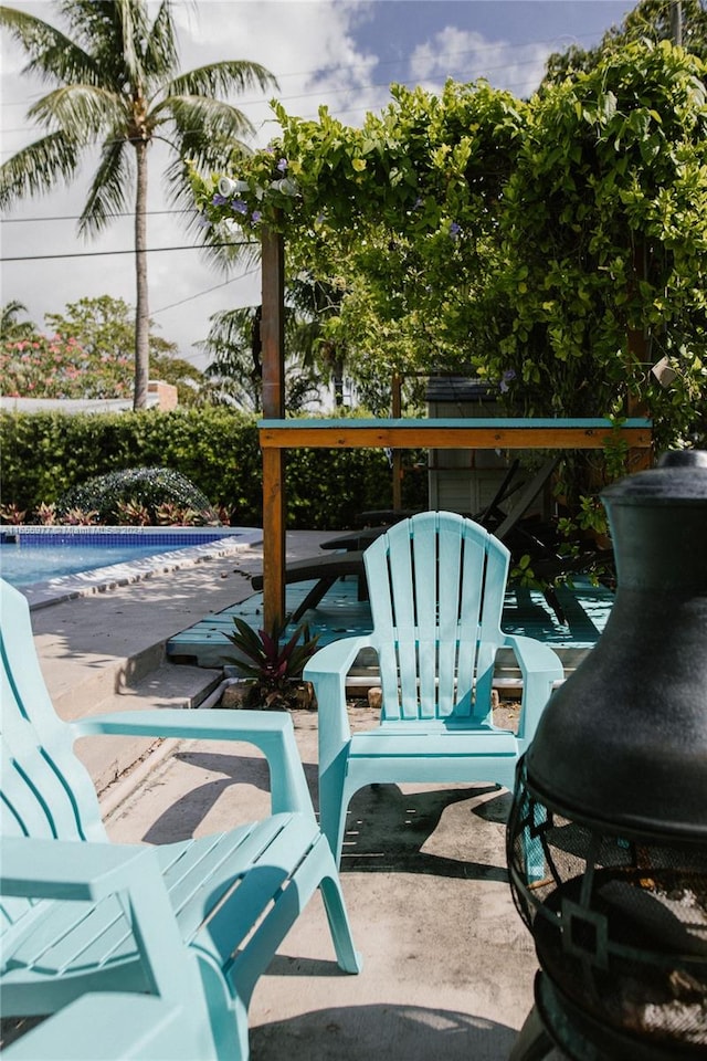 view of patio with an empty pool