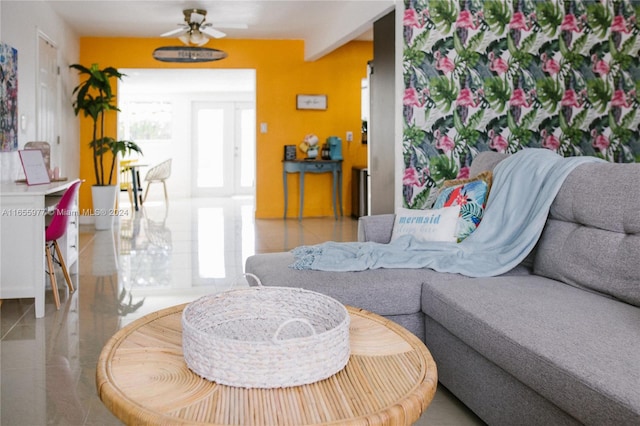 living room with tile patterned flooring and ceiling fan