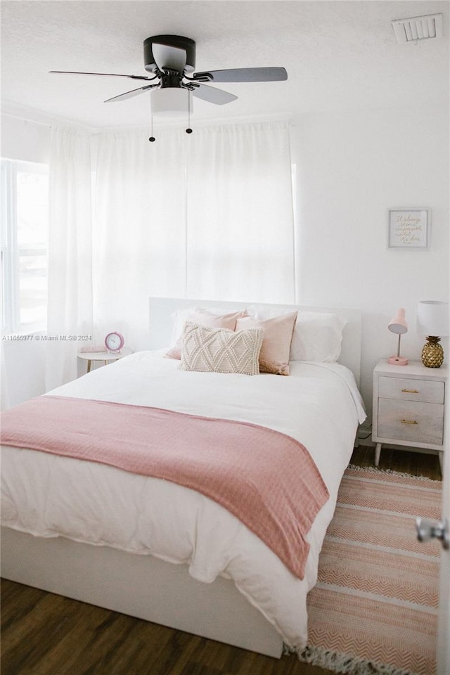 bedroom featuring hardwood / wood-style flooring and ceiling fan