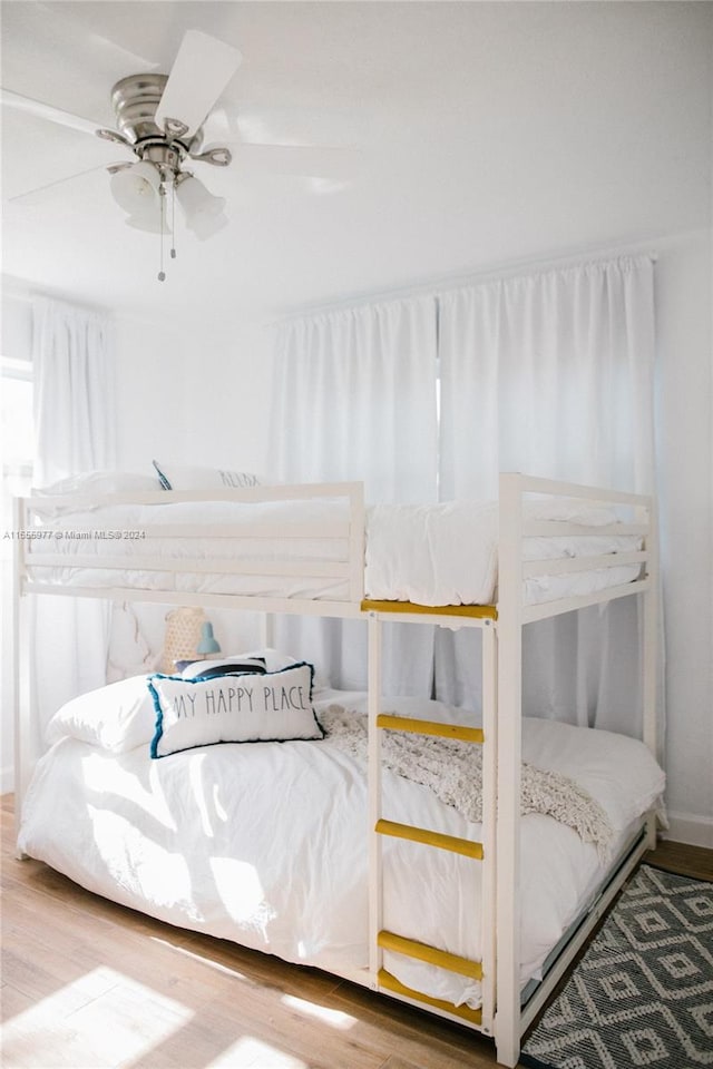 bedroom featuring hardwood / wood-style floors and ceiling fan