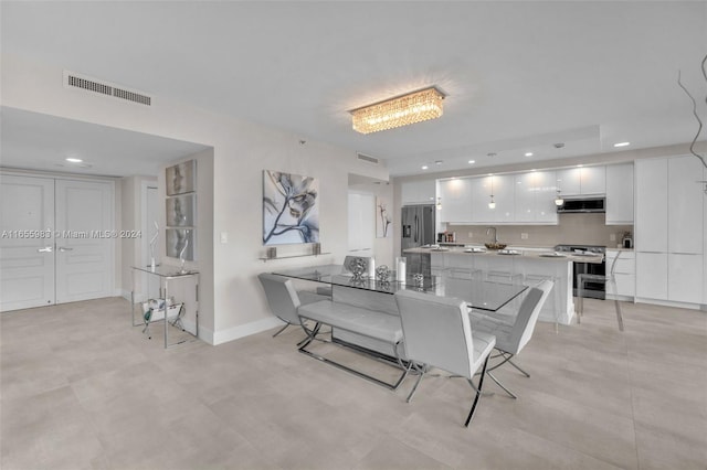 dining space featuring sink