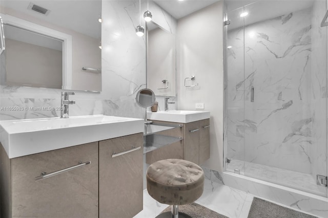 bathroom featuring vanity and an enclosed shower