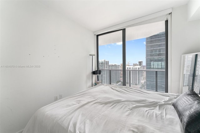 bedroom featuring expansive windows