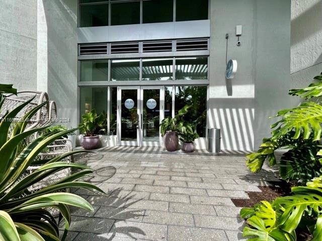 view of exterior entry featuring french doors