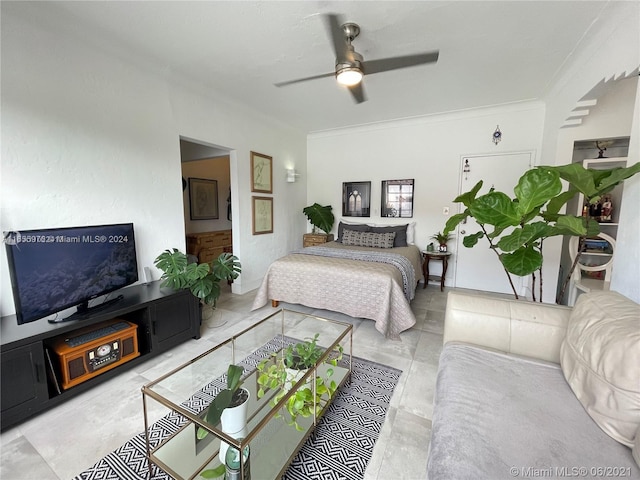 bedroom with crown molding and ceiling fan