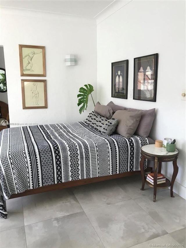 bedroom with crown molding