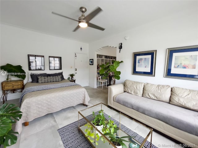 bedroom featuring ceiling fan and tile patterned flooring