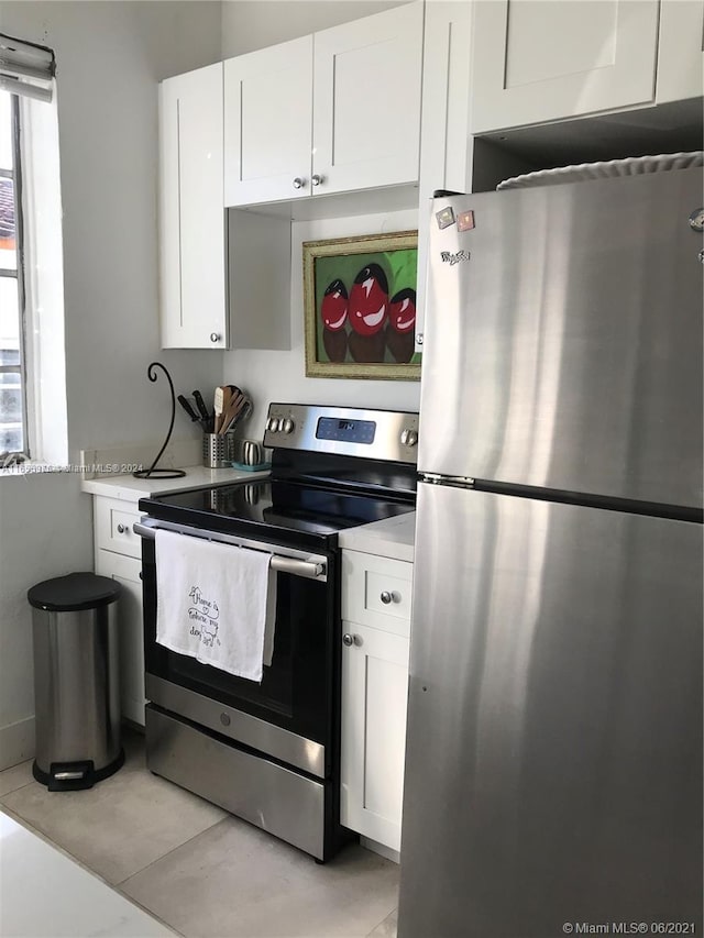 kitchen with white cabinetry and stainless steel appliances