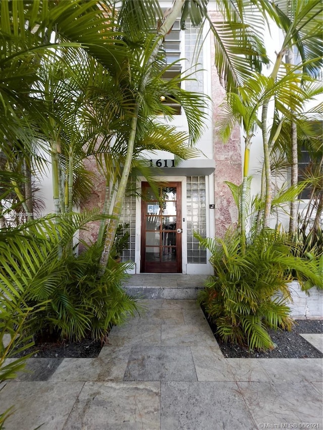 view of exterior entry featuring french doors