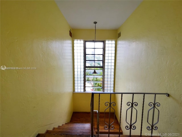 staircase featuring plenty of natural light