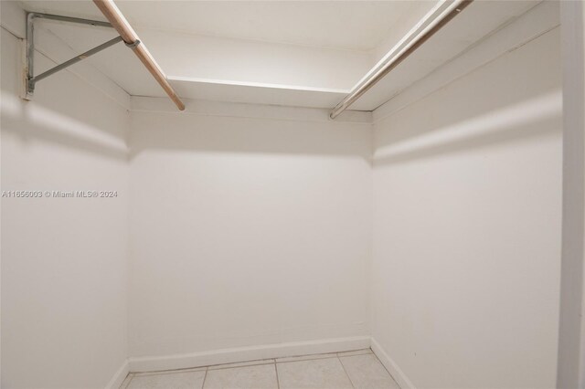 spacious closet featuring light tile patterned flooring