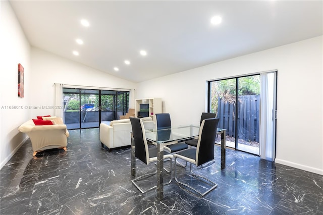 dining space with plenty of natural light and vaulted ceiling