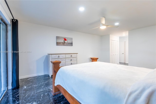 bedroom featuring ceiling fan and a closet