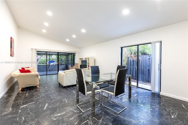 dining area featuring vaulted ceiling and a healthy amount of sunlight