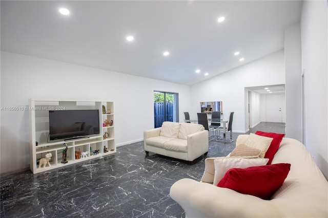 living room featuring lofted ceiling