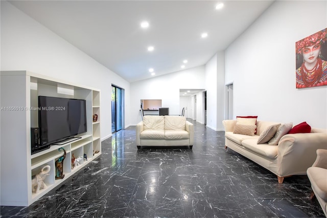 living room featuring high vaulted ceiling