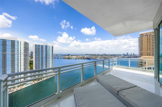 balcony featuring a water view