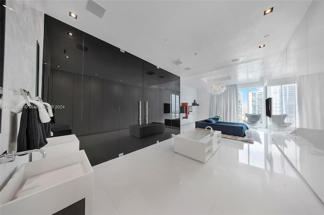 interior space featuring tile patterned flooring and a chandelier