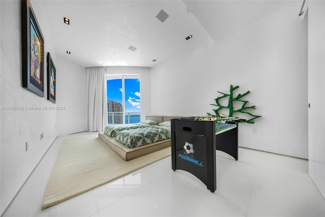 bedroom featuring light tile patterned flooring