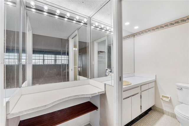 bathroom with tile patterned floors, vanity, and toilet