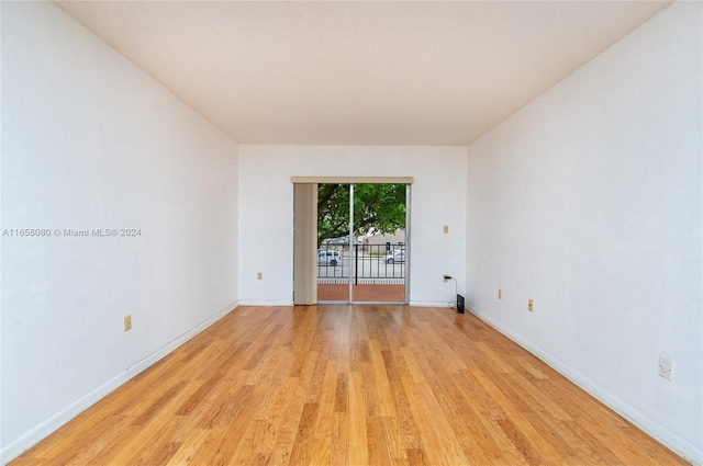 unfurnished room with light hardwood / wood-style flooring