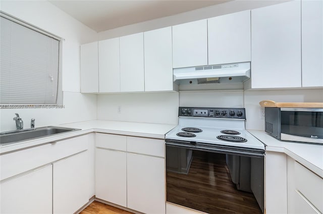 kitchen featuring sink, white electric stove, white cabinets, and light hardwood / wood-style floors