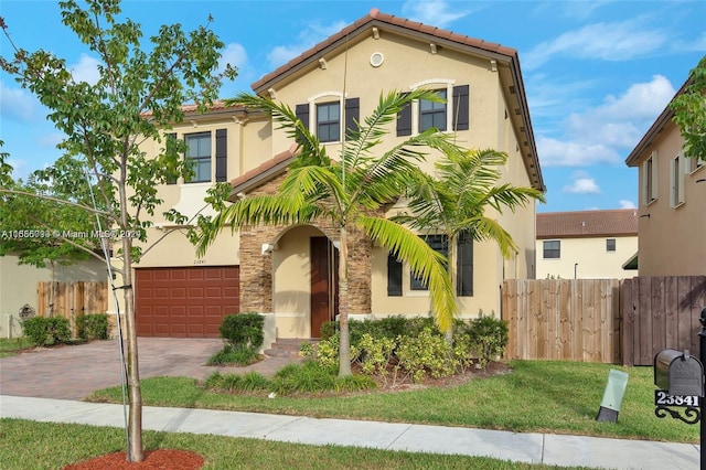 mediterranean / spanish-style home with a garage