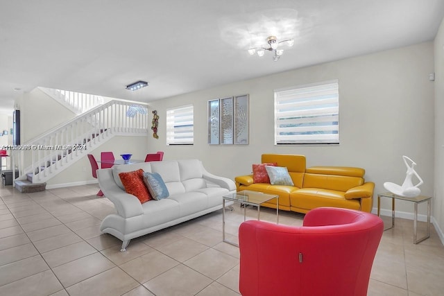 23841 SW 118th Pl, Homestead, FL 33032 - living area with stairs, an inviting chandelier, light tile patterned floors, and baseboards