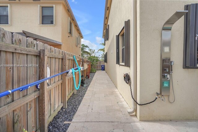 23841 SW 118th Pl, Homestead, FL 33032 - view of side of property with stucco siding and a fenced backyard
