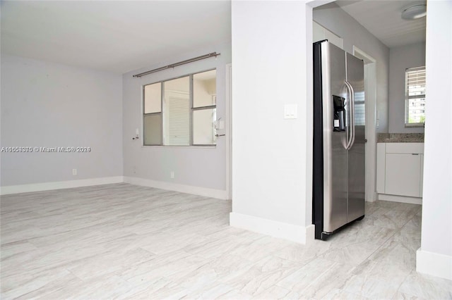 interior space with stainless steel fridge with ice dispenser