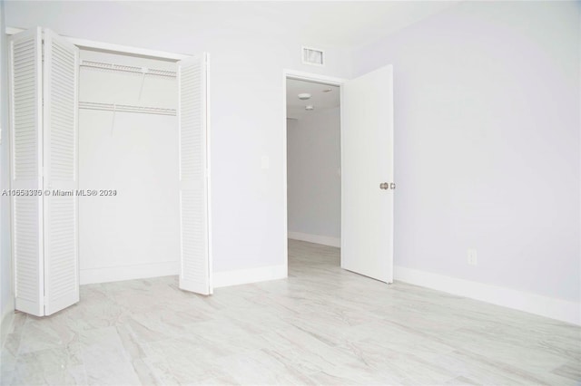 unfurnished bedroom with a closet