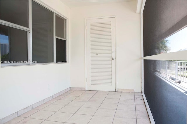 exterior space featuring plenty of natural light and light tile patterned flooring