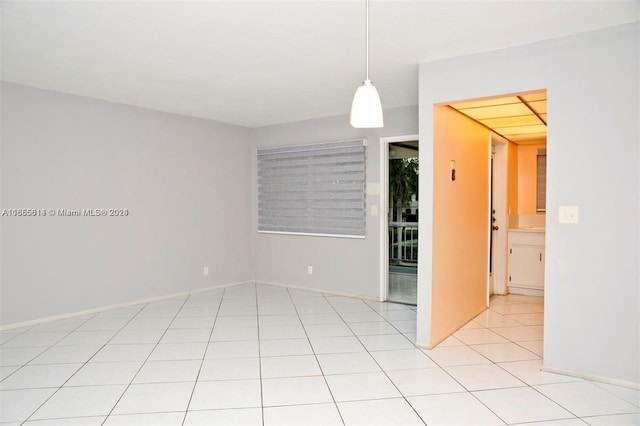 unfurnished room with light tile patterned floors