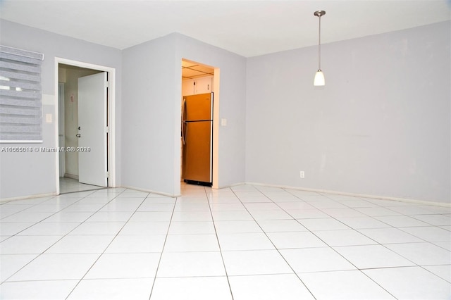 unfurnished room featuring light tile patterned flooring