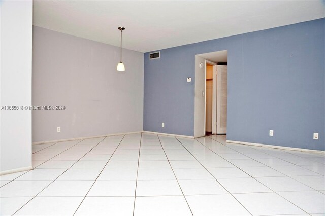 spare room with light tile patterned floors