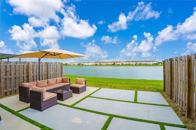 view of patio featuring a water view and outdoor lounge area