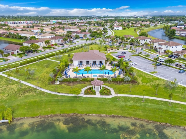 birds eye view of property with a water view