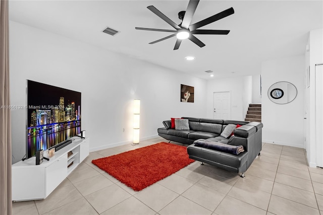 tiled living room with ceiling fan