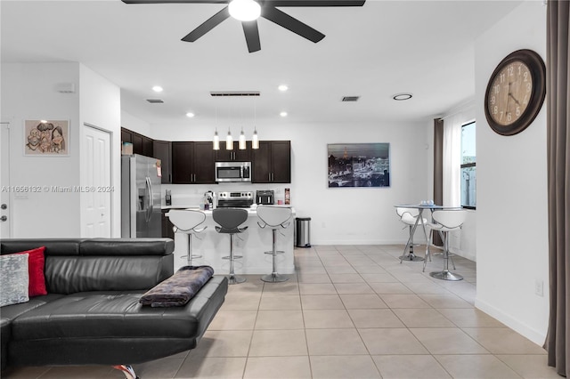 living room featuring ceiling fan and light tile patterned flooring