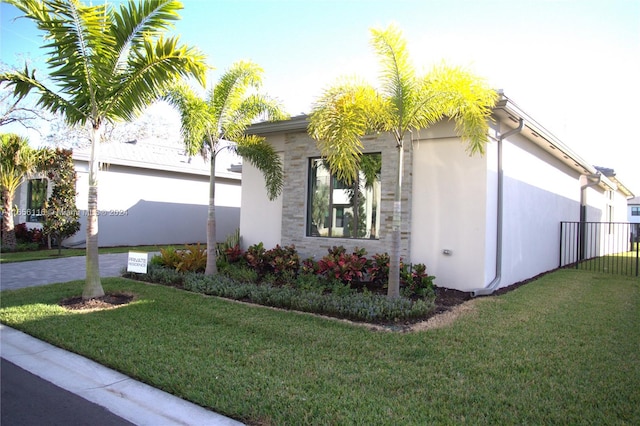 view of home's exterior featuring a lawn