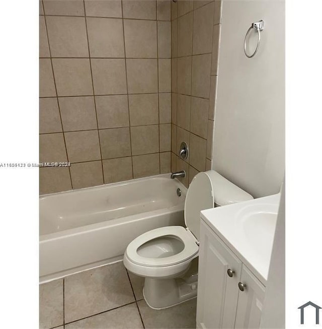 full bathroom with vanity, toilet, tile patterned floors, and tiled shower / bath