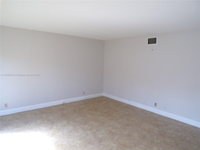 empty room with carpet flooring