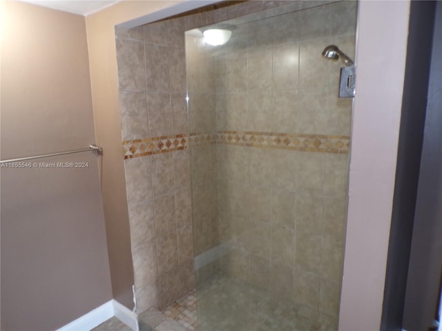 bathroom with a tile shower