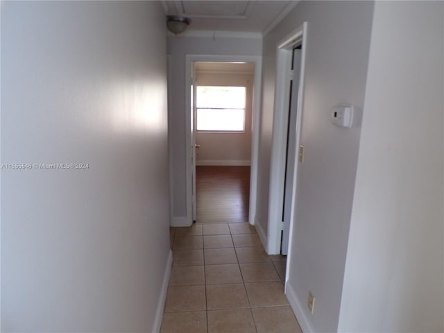 hall with light tile patterned flooring