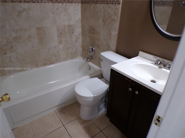 full bathroom featuring tiled shower / bath combo, vanity, toilet, and tile patterned floors