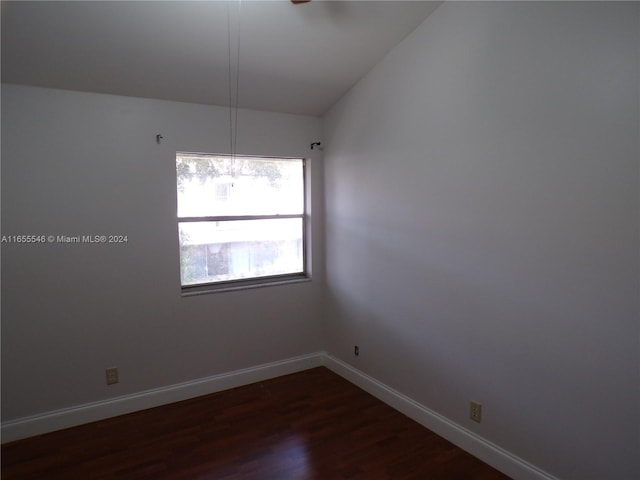 unfurnished room featuring dark hardwood / wood-style floors