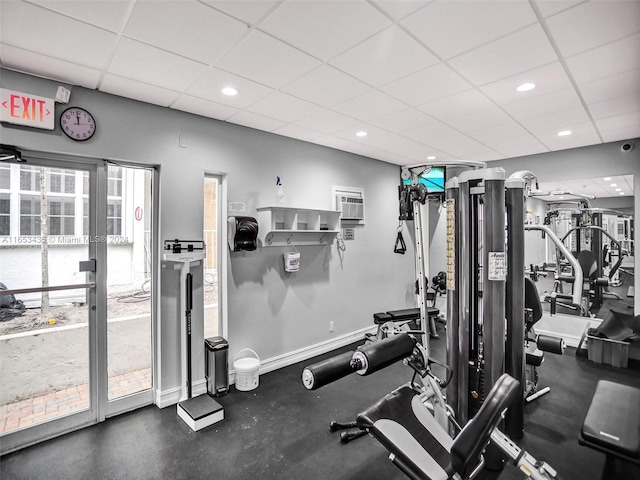 exercise room with a paneled ceiling