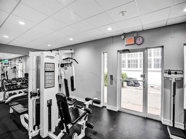 exercise room with a paneled ceiling